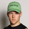 green baseball cap