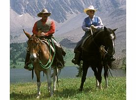 Spectacular Rocky Mountain views and a delicious barbeque await on this rewarding horseback journey along the Sundance Canyon Trail under a sunset sky.